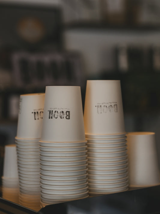 Stacks of coffee cups are ready to be used.